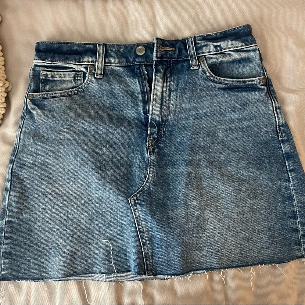 Denim mini skirt super cute color and good length. It was size to small to me.